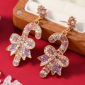 Orecchini a bastoncino di Natale con cristalli colorati e fiocco su portagioie in legno - Stile Strass Viola