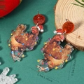 Detail view of funny Christmas chicken acrylic earrings with red glitter studs and measurements - Rooster Style (WEH5573)