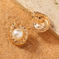 Macro detail of gold shell-shaped clip earrings with faux pearl and size measurements - Conch Shell Pearl Ear Clip Gold Style (WEH5061)