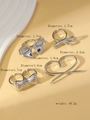 Détail de bagues nœuds argentées et breloque cœur avec mesures de diamètre - Styles Combinaison Nœud Mode (WR1170) / K Blanc/Argent