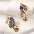 Detail of vintage gold-tone earrings with irregular texture and blue oval crystal - Gold (WEH5620)