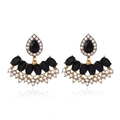 Macro shot of ethnic vintage earrings with black crystals and diamonds on gold base - Golden Black Fan Style (EH5560)
