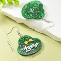 Close-up of green translucent acrylic heart earrings with glitter and Lucky lettering - Heart Shamrock Style (WEH5923)