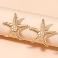 Golden starfish stud earrings with white pearl center and textured metal finish - Starfish Pearl Style (WEH5554) / KC Gold
