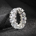 Macro shot of silver eternity ring with oval-cut cubic zirconia in claw setting - US 5 / White