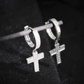 Macro shot of silver cross drop earrings with sparkling zircon pave insets - Silver