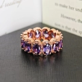Rose gold ring featuring oval purple gemstones surrounded by sparkling cubic zirconia - US 5 / Purple