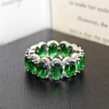 Elegant silver ring with oval emerald green cubic zirconia and sparkling accents - US 5 / Green
