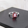 Macro shot of S925 silver ring featuring a large rectangular red gemstone in four-prong setting - Red
