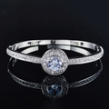 Elegant silver halo bangle with a large round cubic zirconia and sparkling micro-pave setting - Silver Halo Solitaire Style