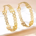 Close-up of gold hoop earrings with hollow 'Blessed' lettering and hip-hop punk style - Blessed Letter Hoop (en-1-e057-3)