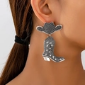 Detail of silver vintage western earrings with cowboy hat and star boots on model - Vintage Silver Cowboy Boot Style (en-19-e051-1)