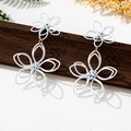 Detail view of large white floral earrings with matte finish and gold metal link - White Double Layer Flower Drop Earrings (en-19-e028-White)