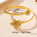 Détail du bracelet de bras doré avec fleur et spécifications de taille et de poids - Brassard doré S4-3-05
