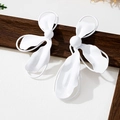 Detail of matte white geometric flower earrings with irregular petals and metal frame - Matte White Abstract Wave Earrings (E20-4-15)