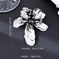 Silver-finish vintage flower brooch with black crystal pistil measuring 7cm by 6cm - Silver