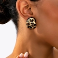 Close-up of stylish leopard print knot stud earrings with golden metallic finish on ear - 3D Twisted Rounded Leopard Style (t-12-t043-4)