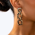 Close-up of three-link geometric rectangle drop earrings with gold-tone finish and leopard print - Geometric Triple Ring Rectangular Leopard Style (t-12-t043-3)