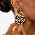 Close-up of leopard print pattern on golden textured wavy metal earrings for women - Large Circular Ripple Leopard Style (t-12-t045-1)
