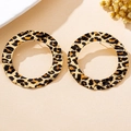 Macro detail of large gold-tone round hoop earrings with leopard print and hammered texture - Large Round Flat Leopard Style (t-12-t045-3)