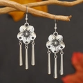 Vintage silver flower tassel earrings with conical pendants on a wooden branch background - Five-Petal Flower Tapered Tassel Style (WEH4470) / Antique Silver