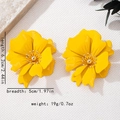 Detail view of yellow floral earrings with dimensions 6.2cm long and 5cm wide - Yellow