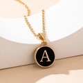 Minimalist gold necklace featuring letter A pendant on high-quality white stone background - Letter A