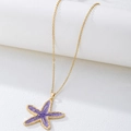 Elegante gouden zeester hanger ketting met paars emaille voor een vakantiestijl - Paars