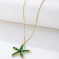 Gedetailleerde weergave van de zeester hanger met groene en zwarte emaille details - Groen