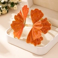 Detailed macro view of large orange marble petal bangle with gold plated metal finish - Orange Bangle