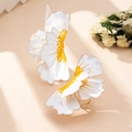 Macro shot of large floral earrings with white petals, yellow core, and gold-trimmed edges - White Ring Collection