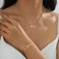 Elegant gold Baby letter necklace and bracelet jewelry set shown on female model - Gold Baby Letter Set (t-9-t027-Set)