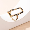 Macro view of geometric open ring featuring cheetah print and golden hollow rectangular design - Ring (t-2-t039)