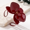 Macro detail of wine red orchid bangle with enamel finish and gold stamen accents - Wine Red Bracelet