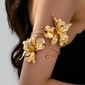 Chic oversized gold orchid arm cuff with artistic irregular metallic flower design - Gold