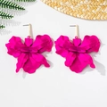 Macro shot of 3D orchid flower earrings in magenta finish on a summer vacation background - Stud Earrings / Rose Red