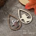Detail view of teardrop wood earrings with cowboy boot cutout and cow print pattern - Cow Print Cowboy Boot Style (WEH3920)