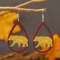 Teardrop wood earrings with leopard bear silhouette hanging on a natural branch - Yellow Leopard Bear (WEH3918)