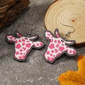 Cow head pattern earrings with pink and white cow print textures on rustic wood base - Pink Cow Print (WEH3922)