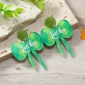 Detail of St. Patrick's Day acrylic earrings with green glitter and Lucky text design - Green Plaid Lucky Bow (WEH4154)
