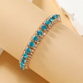Luxe boheemse armband met drie rijen kristallen en blauwe stenen op een gouden legering - Lichtblauw (KC Goud)