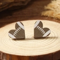 Detailed view of heart-shaped wooden stud earrings with American football pattern texture - Rugby Pattern (WEH4166)