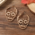 Exaggerated rose gold Mexican sugar skull hoop earrings with heart-shaped cutouts - Gold