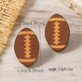 Detailed view of wooden American football earrings showing dimensions and natural texture - Dark Coffee