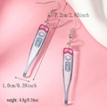Detail shot of acrylic thermometer earrings with 7.2cm length and 4.8g weight specs - Thermometer Style (WEH4634) / White