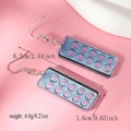 Detailed view of pink acrylic heart capsule earrings with size markings 6.2cm long - Heart Pill Board Style (WEH4632) / Gray