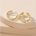 Detailed view of two gold open rings featuring wave and daisy floral patterns with 1.4cm inner diameter - Daisy Petal Style (WJR005)