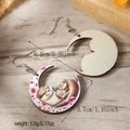 Close-up of wooden crescent earrings with sea otter prints and size dimensions - Moon Otter Style (WEH4682)