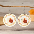 Close-up of wooden drop earrings featuring a cartoon snail family in a berry wreath - White Snail