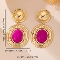 Detail view of vintage gold earrings with purple resin stones and size measurements - Rose Red